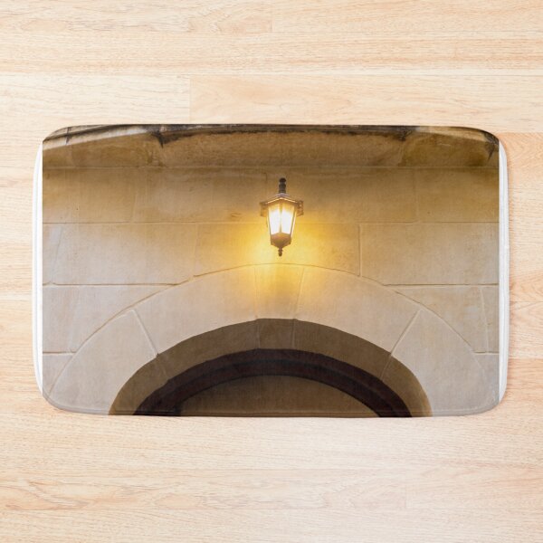 Item preview, Warm Wall Lantern Lighting Stone Archway Over Historic Entrance At Evening Glow designed and sold by Nmallia.