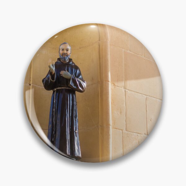 Item preview, Saint Statue In Church Niche On Stone Wall Evoking Faith And Quiet Devotion In Sunlight designed and sold by Nmallia.