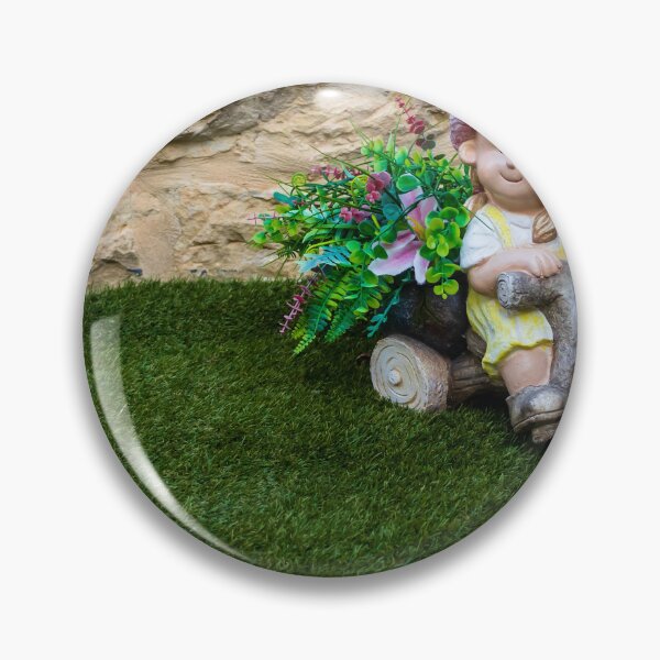 Item preview, Whimsical Garden Figurine Of Girl On Wooden Tricycle With Flowers Against Stone Wall designed and sold by Nmallia.