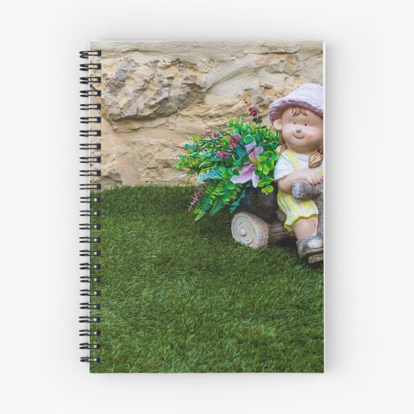 Item preview, Whimsical Garden Figurine Of Girl On Wooden Tricycle With Flowers Against Stone Wall designed and sold by Nmallia.