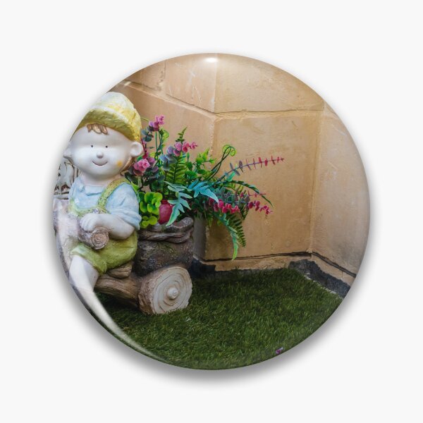 Item preview, Whimsical Garden Figurine Of Girl On Wooden Tricycle With Flowers Against Stone Wall designed and sold by Nmallia.