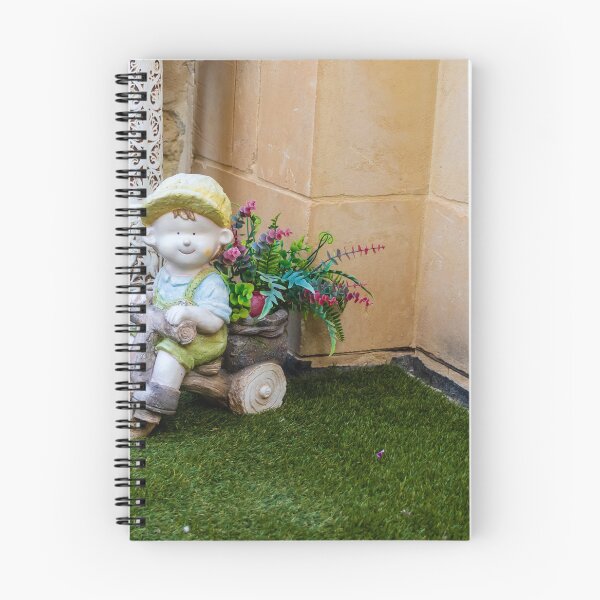 Item preview, Whimsical Garden Figurine Of Girl On Wooden Tricycle With Flowers Against Stone Wall designed and sold by Nmallia.