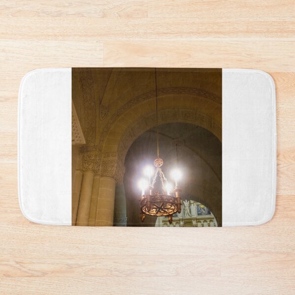 Item preview, Ornate Chandelier Hanging In Historic Stone Church Interior With Arches And Decorative Carvings designed and sold by Nmallia.