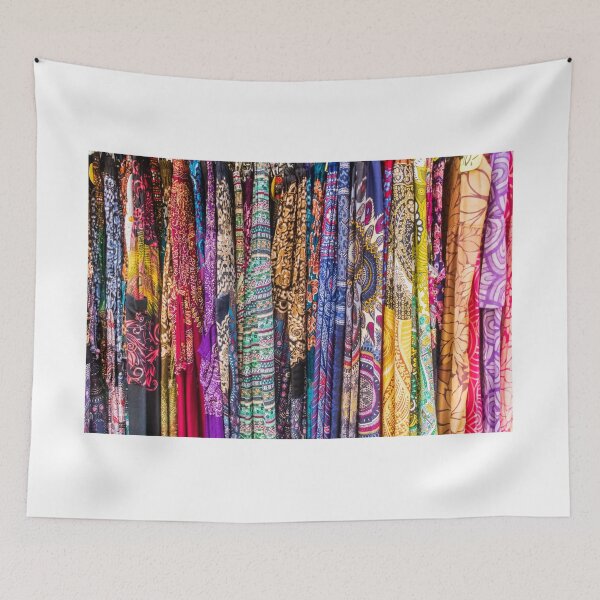 Item preview, Colorful Patterned Fabrics and Scarves Hanging in a Vibrant Textile Market Display designed and sold by Nmallia.
