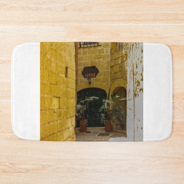 Item preview, Sunny Narrow Mediterranean Alley With Dark Wooden Door, Stone Walls, Potted Plants and Archway designed and sold by Nmallia.