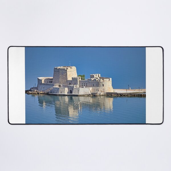 Item preview, Bourtzi water fortress is reflected in the water, Nafplio, Peloponnese, Greece designed and sold by goceris.