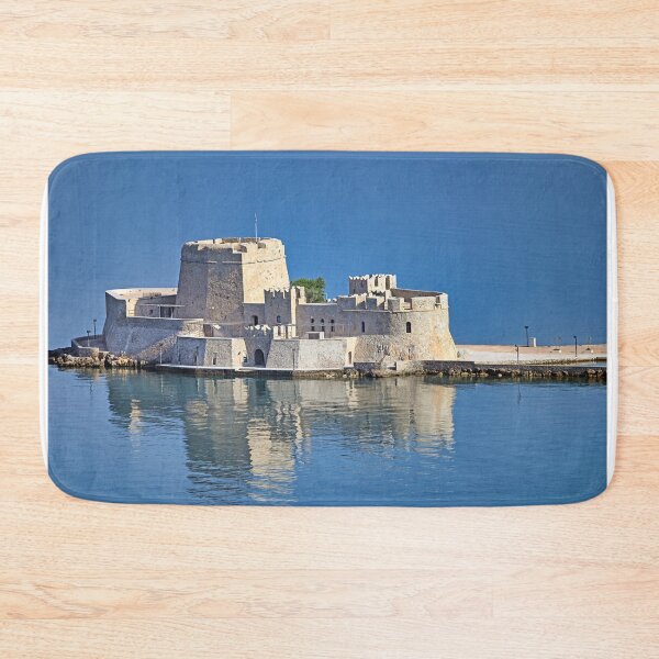 Item preview, Bourtzi water fortress is reflected in the water,  Nafplio, Peloponnese, Greece designed and sold by goceris.