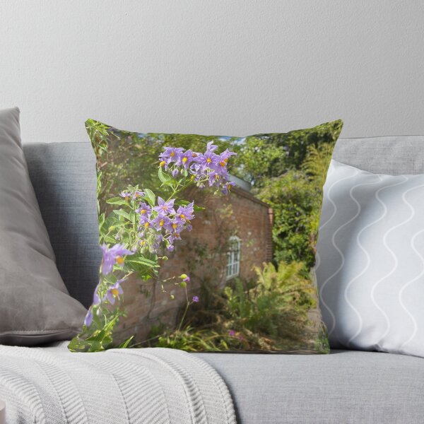 Item preview, Flowers in front of a brick building designed and sold by ForestedDesigns.