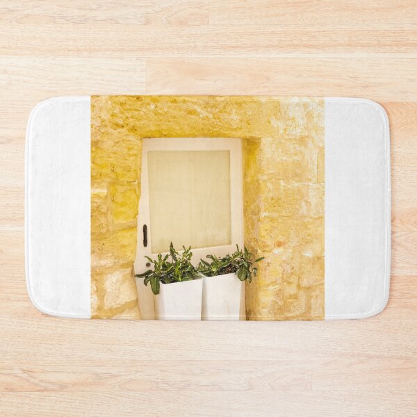 Item preview, White Door With Potted Plants Against Rustic Yellow Stone Wall In Sunny Mediterranean Alley designed and sold by Nmallia.