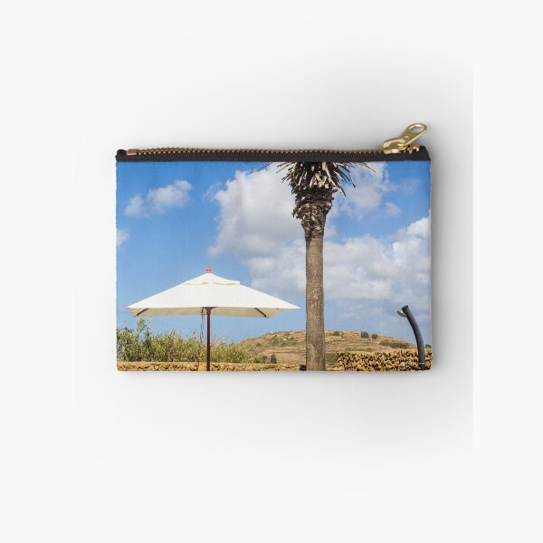 Item preview, Sunny Resort Pool With Palm Tree, Umbrella and Lounge Chairs Overlooking Stone Wall and Blue Sky designed and sold by Nmallia.