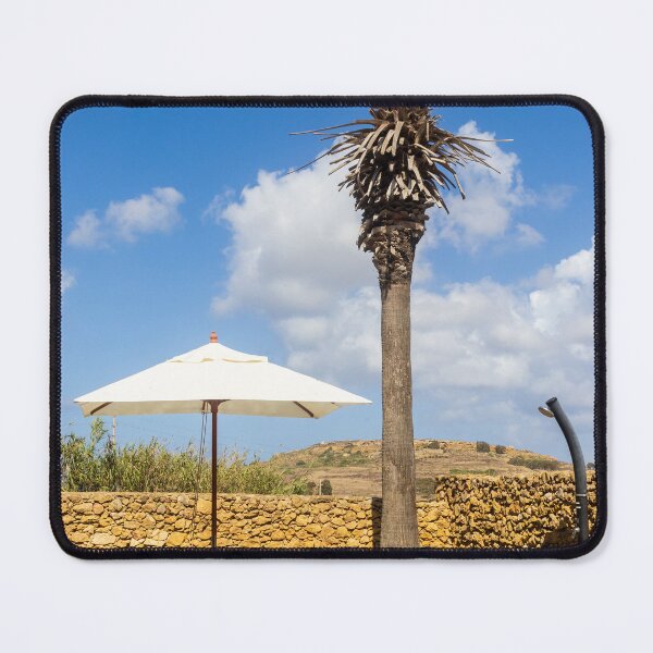 Item preview, Sunny Resort Pool With Palm Tree, Umbrella and Lounge Chairs Overlooking Stone Wall and Blue Sky designed and sold by Nmallia.