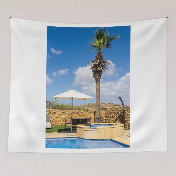Item preview, Sunny Resort Pool With Palm Tree, Umbrella and Lounge Chairs Overlooking Stone Wall and Blue Sky designed and sold by Nmallia.