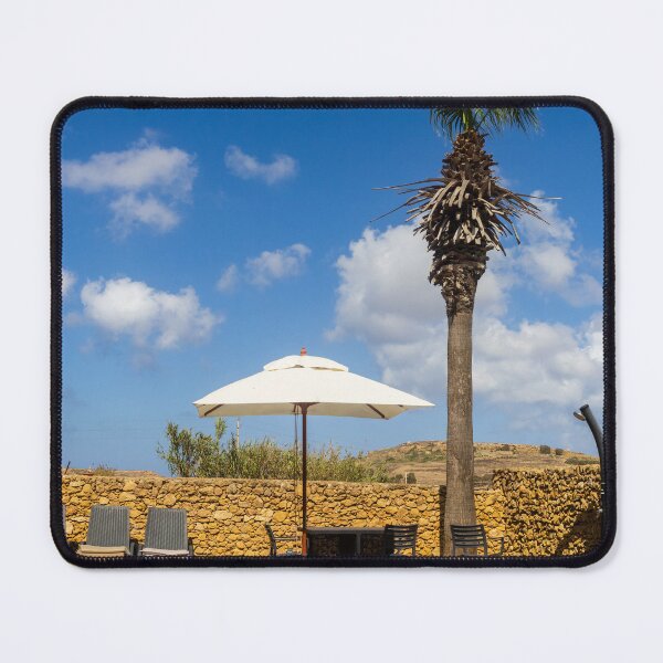 Item preview, Sunny Resort Pool With Palm Tree, Umbrella and Lounge Chairs Overlooking Stone Wall and Blue Sky designed and sold by Nmallia.