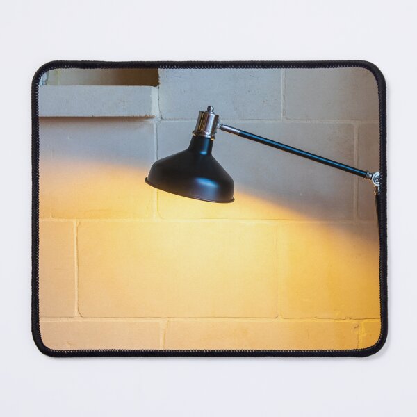 Item preview, Black Adjustable Desk Lamp Casting Warm Light on Textured Stone Wall in Cozy Interior designed and sold by Nmallia.