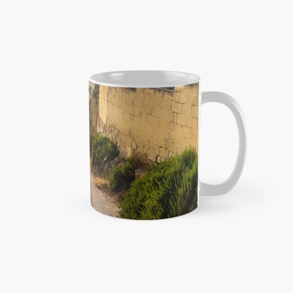 Item preview,  Sunlit Stone Path Through Rural Mediterranean Village Between Dry Stone Walls Overlooking Coast designed and sold by Nmallia.