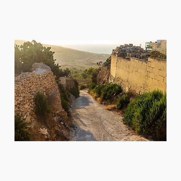 Item preview,  Sunlit Stone Path Through Rural Mediterranean Village Between Dry Stone Walls Overlooking Coast designed and sold by Nmallia.