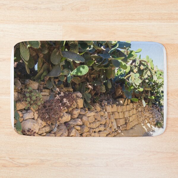 Item preview, Prickly Pear Cactus Cluster On Stone Wall At Golden Sunset Over Rural Mediterranean Hills designed and sold by Nmallia.