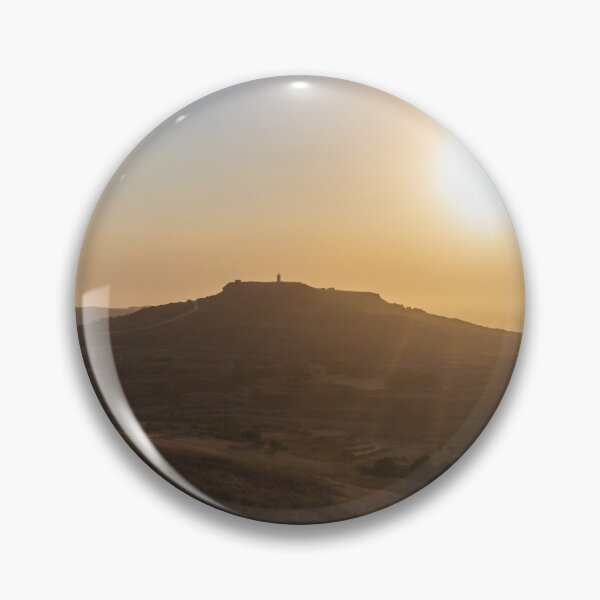 Item preview, Golden Sunset Over Rural Hill With Silhouetted Tower and Rolling Countryside in Warm Light designed and sold by Nmallia.