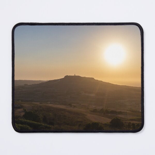 Item preview, Golden Sunset Over Rural Hill With Silhouetted Tower and Rolling Countryside in Warm Light designed and sold by Nmallia.