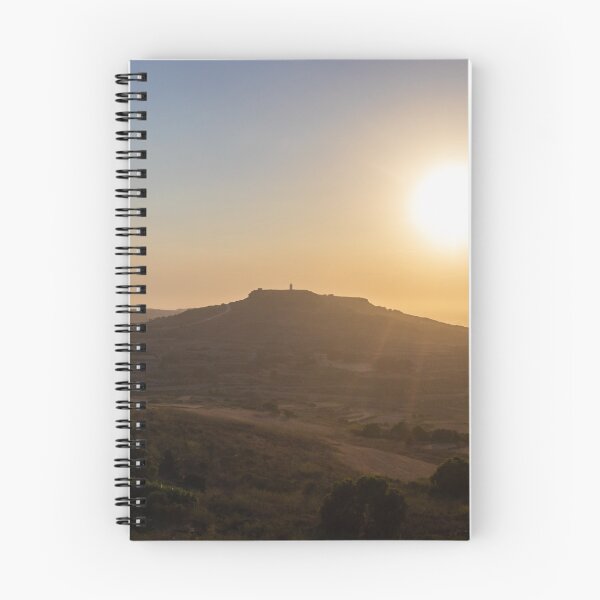 Item preview, Golden Sunset Over Rural Hill With Silhouetted Tower and Rolling Countryside in Warm Light designed and sold by Nmallia.