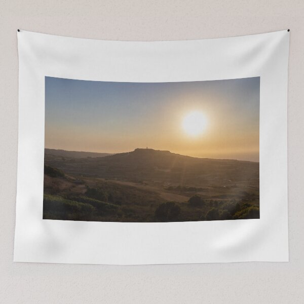 Item preview, Golden Sunset Over Rural Hill With Silhouetted Tower and Rolling Countryside in Warm Light designed and sold by Nmallia.