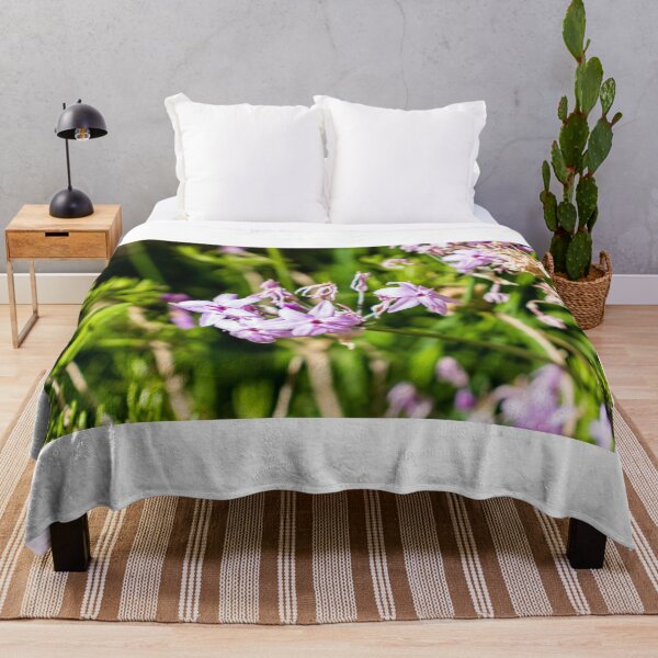 Item preview, Close-Up Of Delicate Purple Wildflowers Blooming In Sunlit Green Garden With Soft Pink Petals designed and sold by Nmallia.