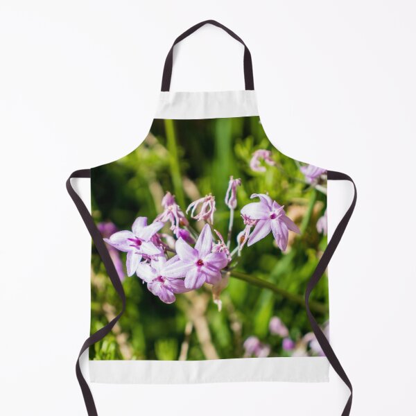 Item preview, Close-Up Of Delicate Purple Wildflowers Blooming In Sunlit Green Garden With Soft Pink Petals designed and sold by Nmallia.