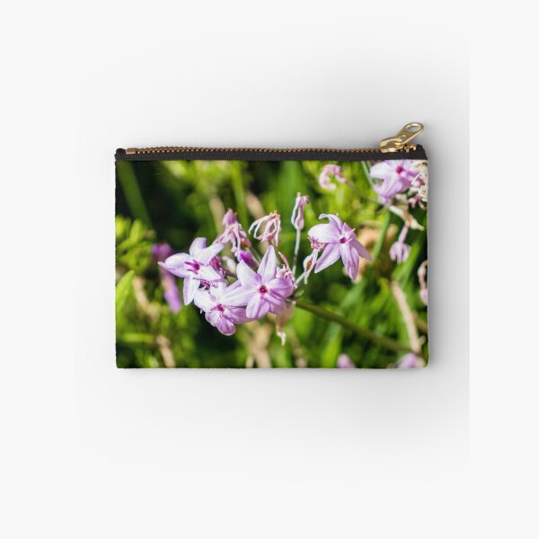 Item preview, Close-Up Of Delicate Purple Wildflowers Blooming In Sunlit Green Garden With Soft Pink Petals designed and sold by Nmallia.