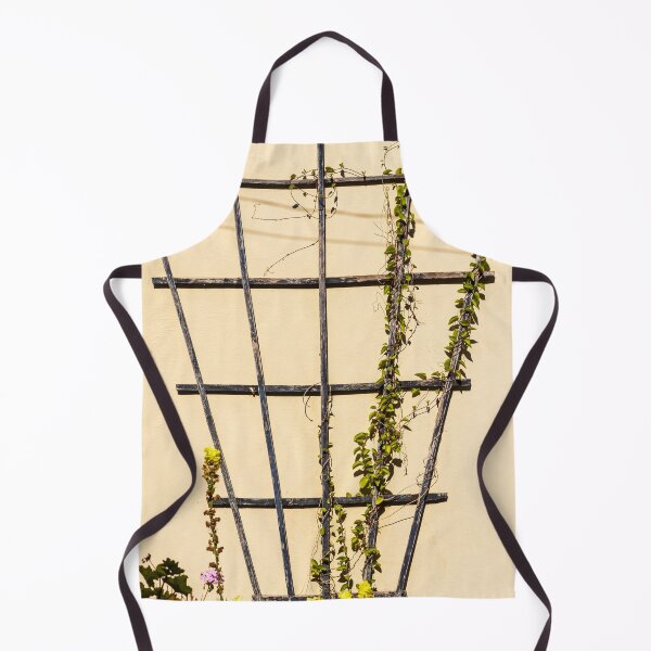 Item preview, Climbing Vines On Rustic Wooden Trellis Against Pale Yellow Garden Wall In Sunlight designed and sold by Nmallia.