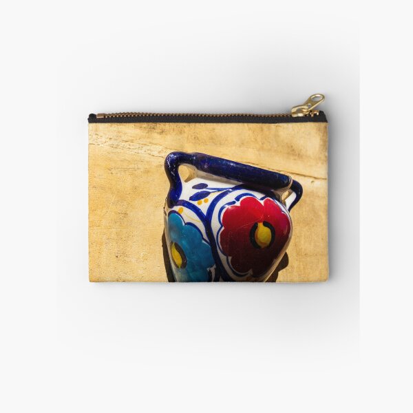 Item preview, Colorful Ceramic Wall Pot With Floral Design Casting Shadow On Rustic Sunlit Stone designed and sold by Nmallia.