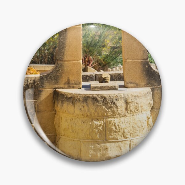 Item preview, Sunlit Stone Well in Rustic Mediterranean Countryside With Sea View and Historic Architecture designed and sold by Nmallia.