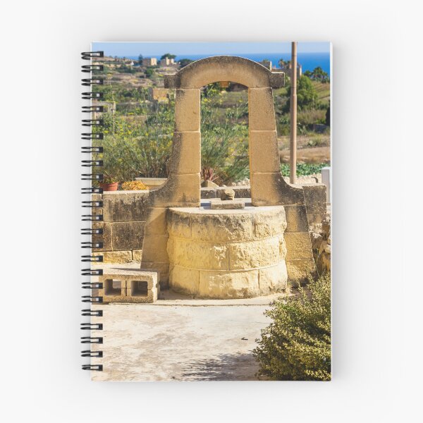 Item preview, Sunlit Stone Well in Rustic Mediterranean Countryside With Sea View and Historic Architecture designed and sold by Nmallia.
