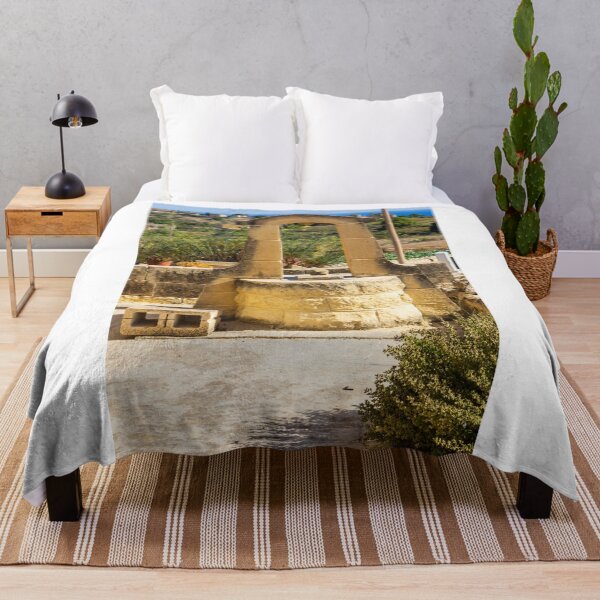 Item preview, Sunlit Stone Well in Rustic Mediterranean Countryside With Sea View and Historic Architecture designed and sold by Nmallia.