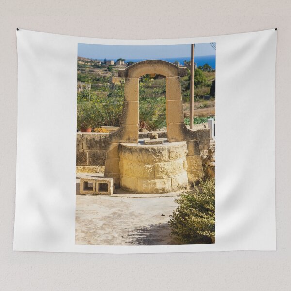 Item preview, Sunlit Stone Well in Rustic Mediterranean Countryside With Sea View and Historic Architecture designed and sold by Nmallia.