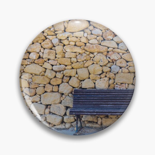 Item preview,  Weathered Wooden Bench Against Rustic Dry Stone Wall On Quiet Sunlit Street designed and sold by Nmallia.