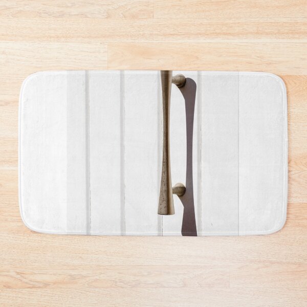 Item preview, Brass Door Handle on White Paneled Door Casting a Sharp Shadow Minimalist Hardware designed and sold by Nmallia.