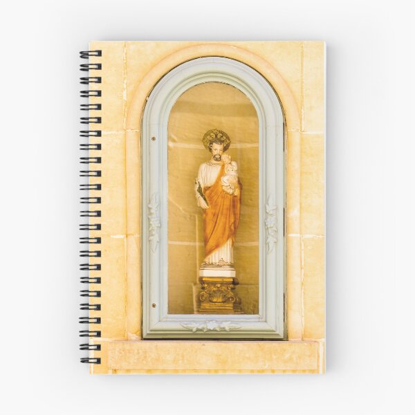 Item preview, Saint Statue Holding Child In Arched Church Niche With Decorative Frame And Warm Stone Wall designed and sold by Nmallia.
