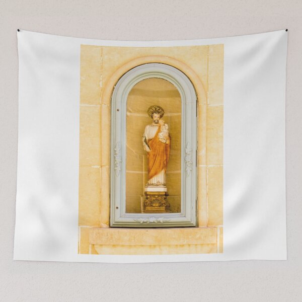 Item preview, Saint Statue Holding Child In Arched Church Niche With Decorative Frame And Warm Stone Wall designed and sold by Nmallia.