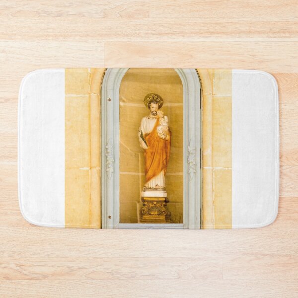 Item preview, Saint Statue Holding Child In Arched Church Niche With Decorative Frame And Warm Stone Wall designed and sold by Nmallia.