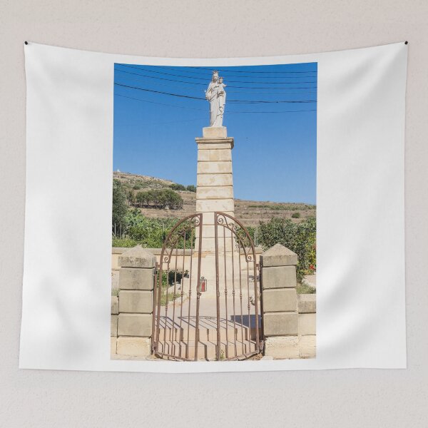 Item preview, Stone Madonna Statue on Pillar Behind Wrought Iron Gate at Rural Shrine Under Blue Sky designed and sold by Nmallia.