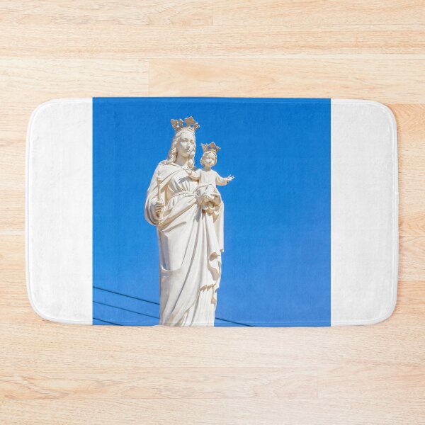 Item preview, Virgin Mary Statue With Child Jesus Wearing Crowns Against Clear Blue Sky designed and sold by Nmallia.