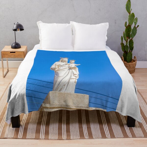 Item preview, Virgin Mary Statue With Child Jesus Wearing Crowns Against Clear Blue Sky designed and sold by Nmallia.