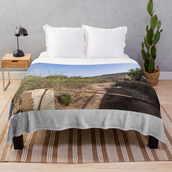 Item preview, Sunny Rural Path Through Mediterranean Countryside With Stone Wall, Yellow Wildflowers and Hilltop Village designed and sold by Nmallia.