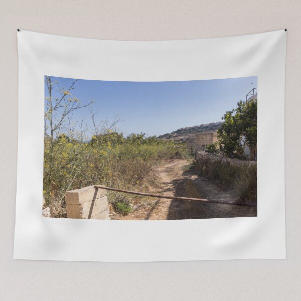 Item preview, Sunny Rural Path Through Mediterranean Countryside With Stone Wall, Yellow Wildflowers and Hilltop Village designed and sold by Nmallia.