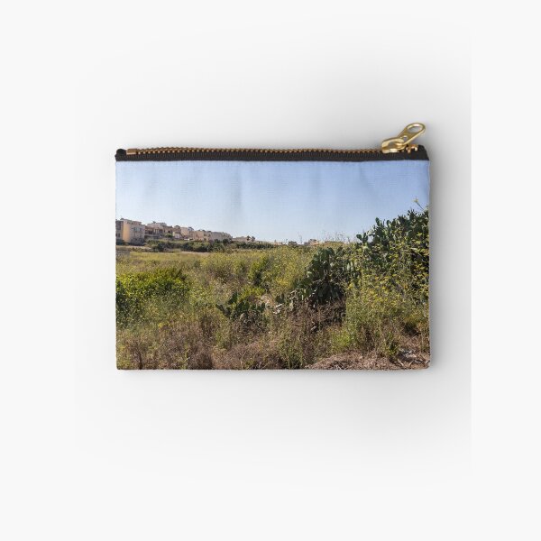 Item preview, Prickly Pear Cactus in Sunny Dry Field Near Low-Rise Town Buildings Under Clear Blue Sky designed and sold by Nmallia.