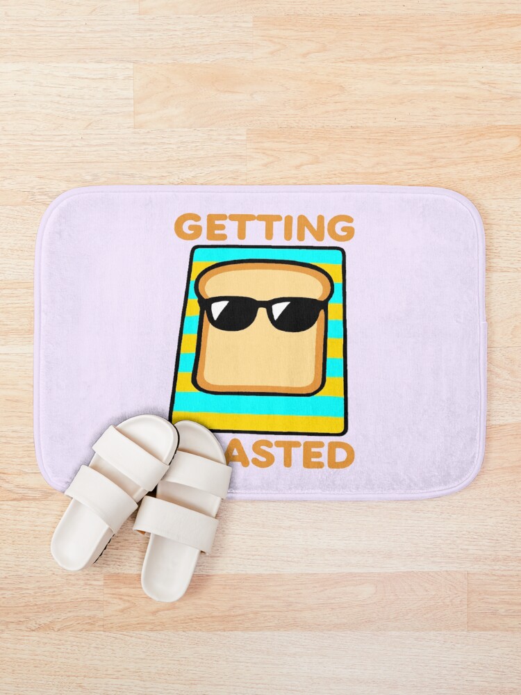 Thumbnail 1 of 6, Bath Mat, Getting Toasted - Sunbathing Toast designed and sold by ReviloIsFree.