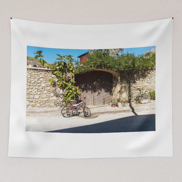 Item preview, Old Bicycle Leaning Against Stone Wall Near Wooden Gate with Potted Plants in Sunny Courtyard designed and sold by Nmallia.