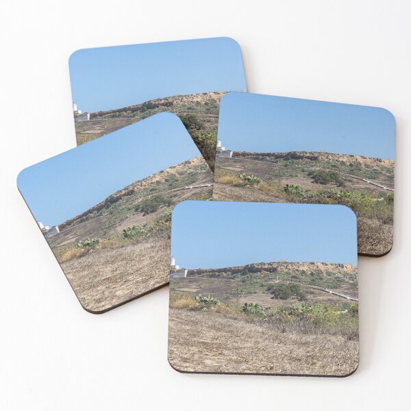 Item preview, White Lighthouse on Arid Coastal Hill Overlooking Dry Landscape and Blue Sky designed and sold by Nmallia.