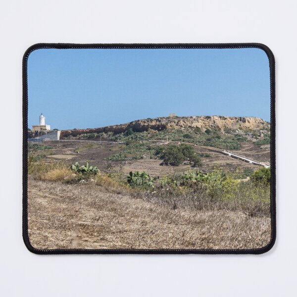 Item preview, White Lighthouse on Arid Coastal Hill Overlooking Dry Landscape and Blue Sky designed and sold by Nmallia.
