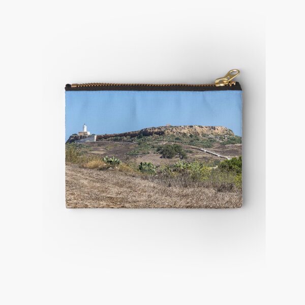 Item preview, White Lighthouse on Arid Coastal Hill Overlooking Dry Landscape and Blue Sky designed and sold by Nmallia.